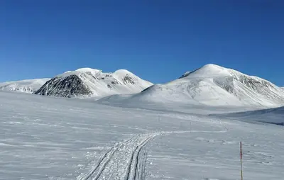a snow covered mountain with a trail in the snow at Stunning Home In Kvam With Wifi in Kvam