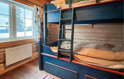 a room with a bunk bed in a cabin at 3 Bedroom Gorgeous Home In Sjusjøen in Sjusjøen