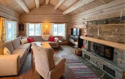 a living room with a couch and a fireplace at 3 Bedroom Gorgeous Home In Sjusjøen in Sjusjøen
