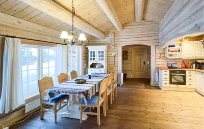 a dining room with a table and chairs in a kitchen at 3 Bedroom Gorgeous Home In Sjusjøen in Sjusjøen