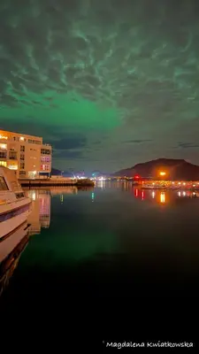 a view of a body of water at night at Bellahuset - Charming House in Ulsteinvik in Ulsteinvik