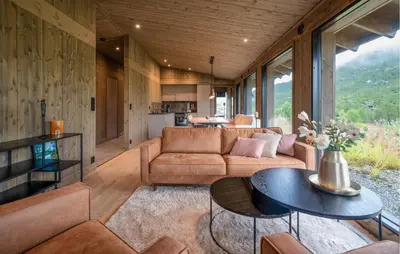 a living room with a couch and a table at 3 Bedroom Nice Home In Vøringsfoss in Maurset