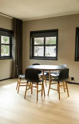 a dining room with a table and chairs at Flåmsbrygga Apartments in Flåm