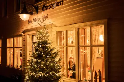 a christmas tree in front of a store at Bekkjarvik Gjestgiveri in Bekkjarvik