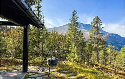 a camera on a porch with a view of the mountains at Stunning Home In Rjukan With Wifi in Rjukan