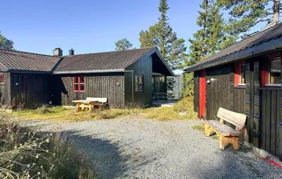 a couple of buildings with benches in front of them at Stunning Home In Rjukan With Wifi in Rjukan