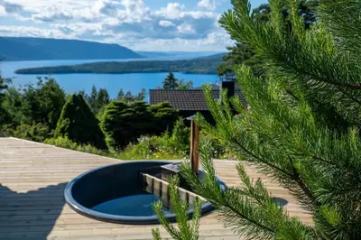 a view of the lake from the deck of a house at Mountain & Lake Haven & Close to Oslo in Stange