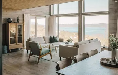 a living room with a couch and a table at 4 Bedroom Amazing Home In Skånevik in Skånevik