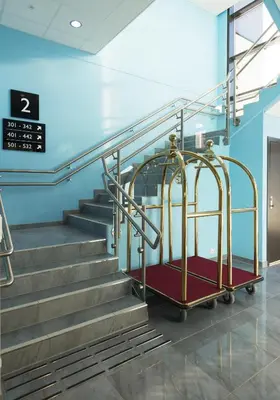 a set of stairs in a hospital with arolley at Thon Hotel Fosnavåg in Fosnavåg