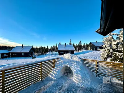 a pile of snow on the side of a fence at Cozy cabin on Sjusjølia by the trail network sauna in Ringsaker