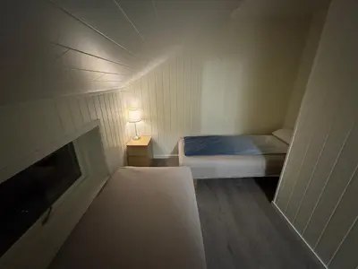 a small room with a bed and a tv at Spacious house in Trysil in Trysil