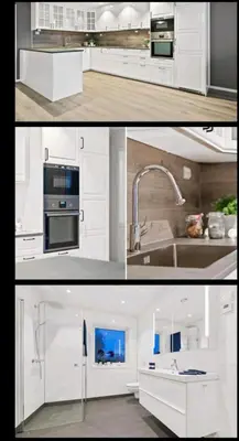 a kitchen with white cabinets and a sink at Hus ved sjøen in Bakken