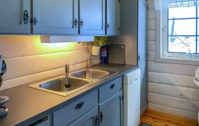 a kitchen counter with a sink and a window at Lovely Home In Stranda With Wifi in Stranda
