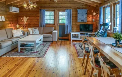 a living room with a couch and a table at Lovely Home In Stranda With Wifi in Stranda