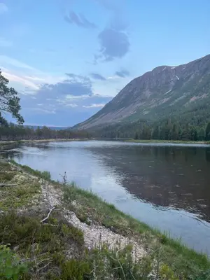 a view of a lake with mountains in the background at ElveRo Lodge in Trysil