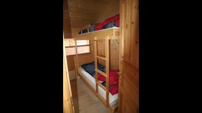 a couple of bunk beds in a cabin at Kinnkosen - cabin with panoramic view for 6 persons in Ål