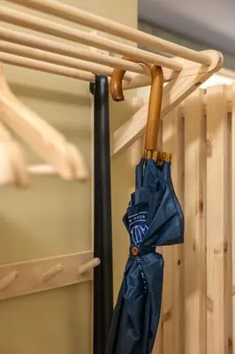 a blue umbrella hanging on a closet door at Fresh studio apartment, a short walk from Bryggen in Bergen