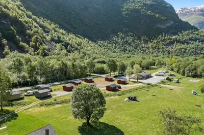 an aerial view of a village in the mountains at Utladalen Camping in Årdal