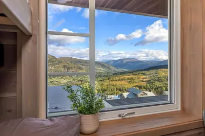 a window with a view of a mountain view at Leilighet - Panorama view - Sogndal Skisenter Hodlekve in Sogndal