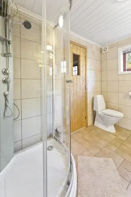 a bathroom with a shower and a toilet at Hytte Stryn skisenter in Stryn