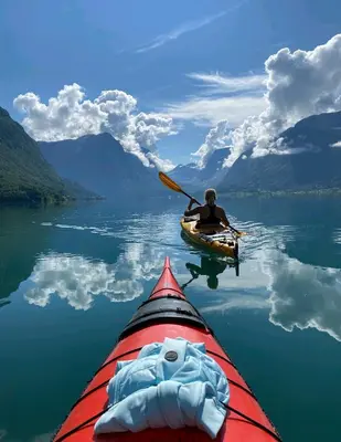 a person paddling a kayak on a lake at Flo Bellevue in Stryn