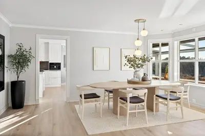 a kitchen and dining room with a table and chairs at Waterfront Villa w/Boat&kayaks. 15min from Bergen in Foldnes