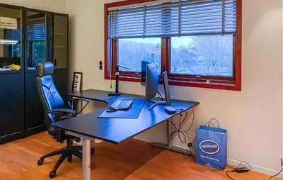 an office with a desk with two computers on it at Pet Friendly Home In Ålesund in Ålesund