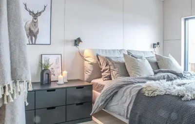 a bedroom with a bed and a table with candles at Gorgeous Home In Bjorli With Wifi in Bjorli
