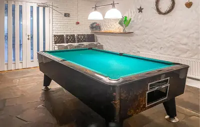 a pool table in a room with a pool table at Gorgeous Apartment In Lillehammer in Lillehammer