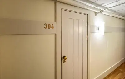 an empty room with a door with the number at Gorgeous Apartment In Lillehammer in Lillehammer
