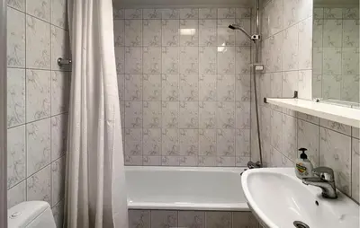 a bathroom with a tub and a sink and a shower at Gorgeous Apartment In Lillehammer in Lillehammer