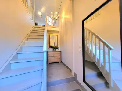 a staircase in a home with blue stairs at Mercury House, Cathedral View ! Free Parking ! in Trondheim