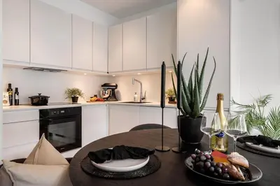 a kitchen with a table with a plate of food on it at New penthouse apartment with sea view in Bergen centrum in Bergen