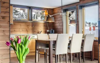 a dining room with a table and chairs at Beautiful Apartment In Meråker in Meråker