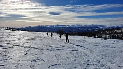 a group of people skiing down a snow covered slope at Sveheim - cabin with an amazing view in Flå