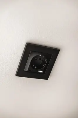 a lightswitch on the ceiling of a room at Bryggen // Fløyen Apartments in Bergen