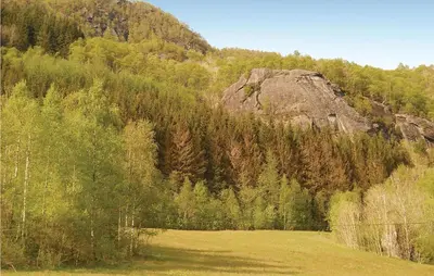 a large field in front of a mountain at Holiday Home Sandeid Ilsvåg in Sandeid