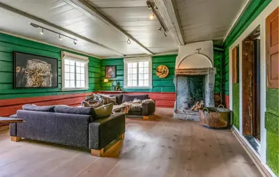a living room with two couches and a fireplace at Nice Home In Bjorli With Wifi in Bjorli