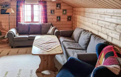 a living room with a couch and a table at 4 Bedroom Pet Friendly Home In Tydal in Tydal