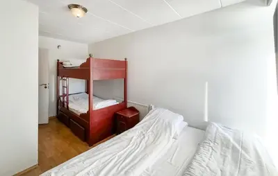 a bedroom with a bed and a bunk bed at Gorgeous Apartment In Kvam With Sauna in Kvam