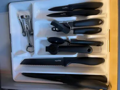 a drawer full of knives and other kitchen utensils at Rjukan Sentrum Apartments NO 1 in Rjukan