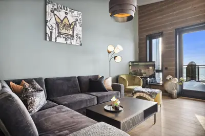 a living room with a couch and a table at Riddergaardens utsikt in Beitostøl