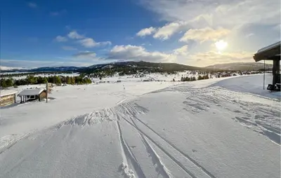 a snow covered slope with tracks in the snow at Nice Apartment In Kvam With Sauna in Kvam