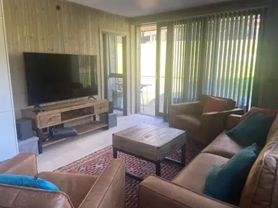 a living room with couches and a flat screen tv at Vister, Hemsedal - fine leiligheter rett ved Fyri Resort - Ski inn - Ski out in Hemsedal