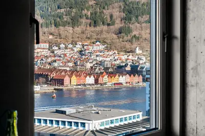 a view of a city from a window at Nordnes - Amazing view of Bryggen! in Bergen