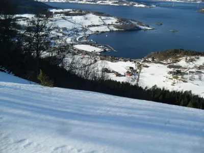 an aerial view of a town in the snow at Orset setra - back to basic cabin - with amazing view in Torvikbukt