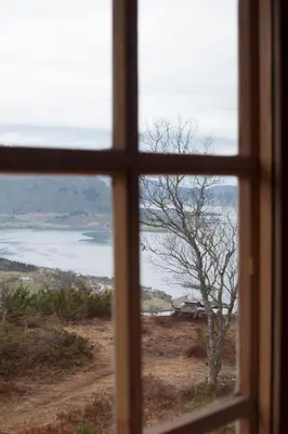 a window view of the ocean from a house at Orset setra - back to basic cabin - with amazing view in Torvikbukt