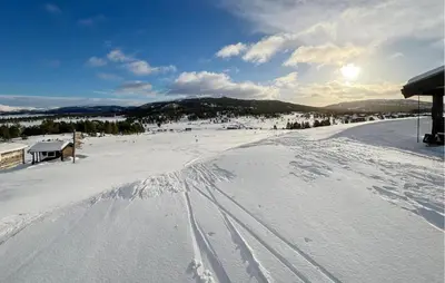 a snow covered slope with tracks in the snow at Gorgeous Apartment In Kvam With Kitchen in Kvam