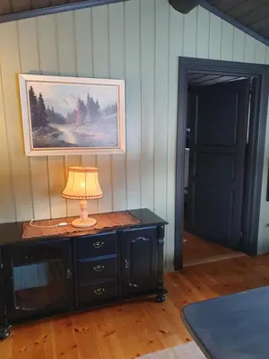 a lamp on top of a dresser in a room at Bjørgebu Camping AS in Mysusæter