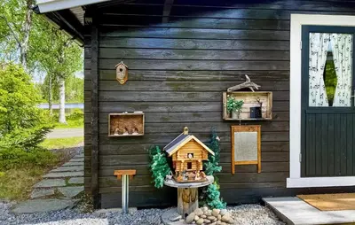 a wooden cabin with a house on the side of it at Nice Home In Gol With Kitchen in Golsfjellet
